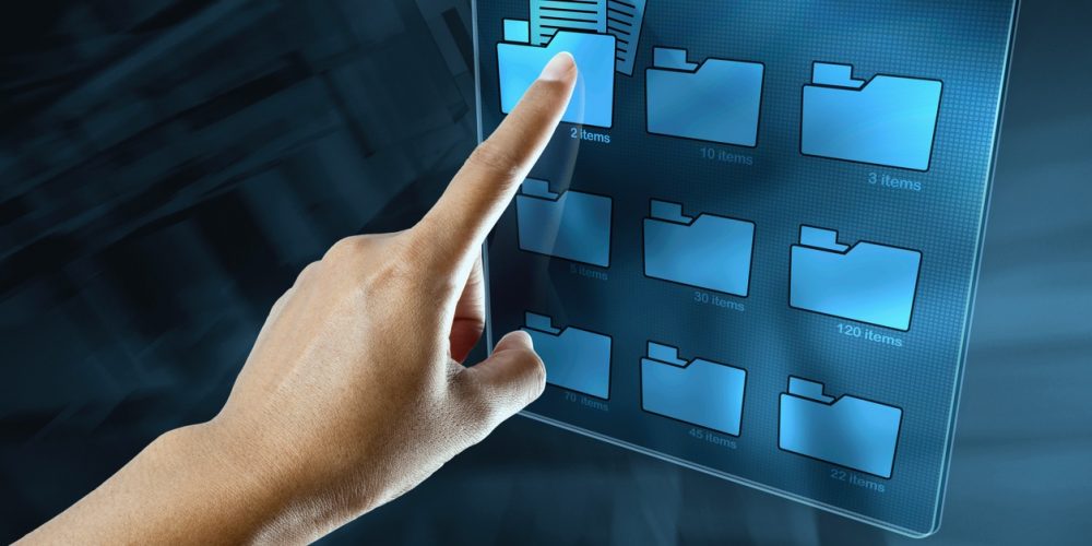 a woman hand is searching data in a folder on a digital screen